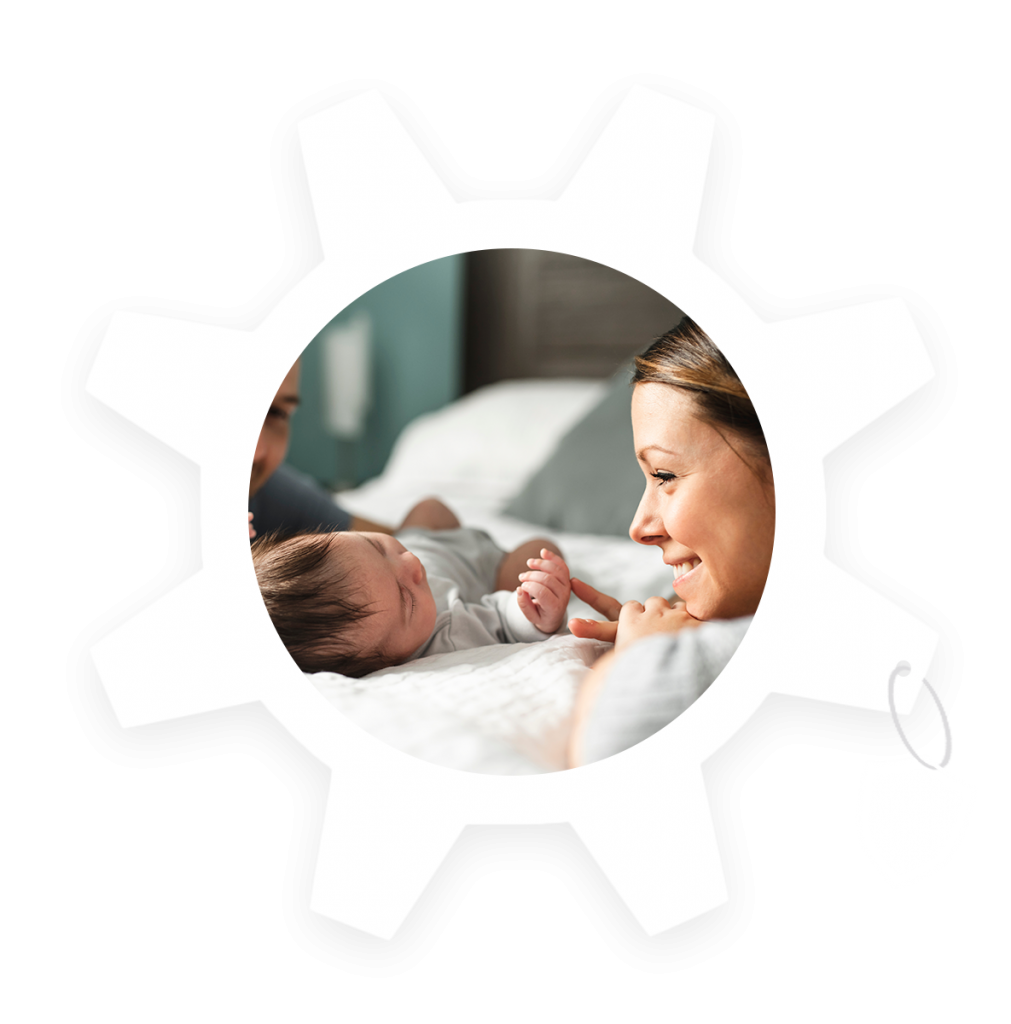 A mother looking over her newborn baby, protecting her. The image is inside a COG that is from the COG Financial logo